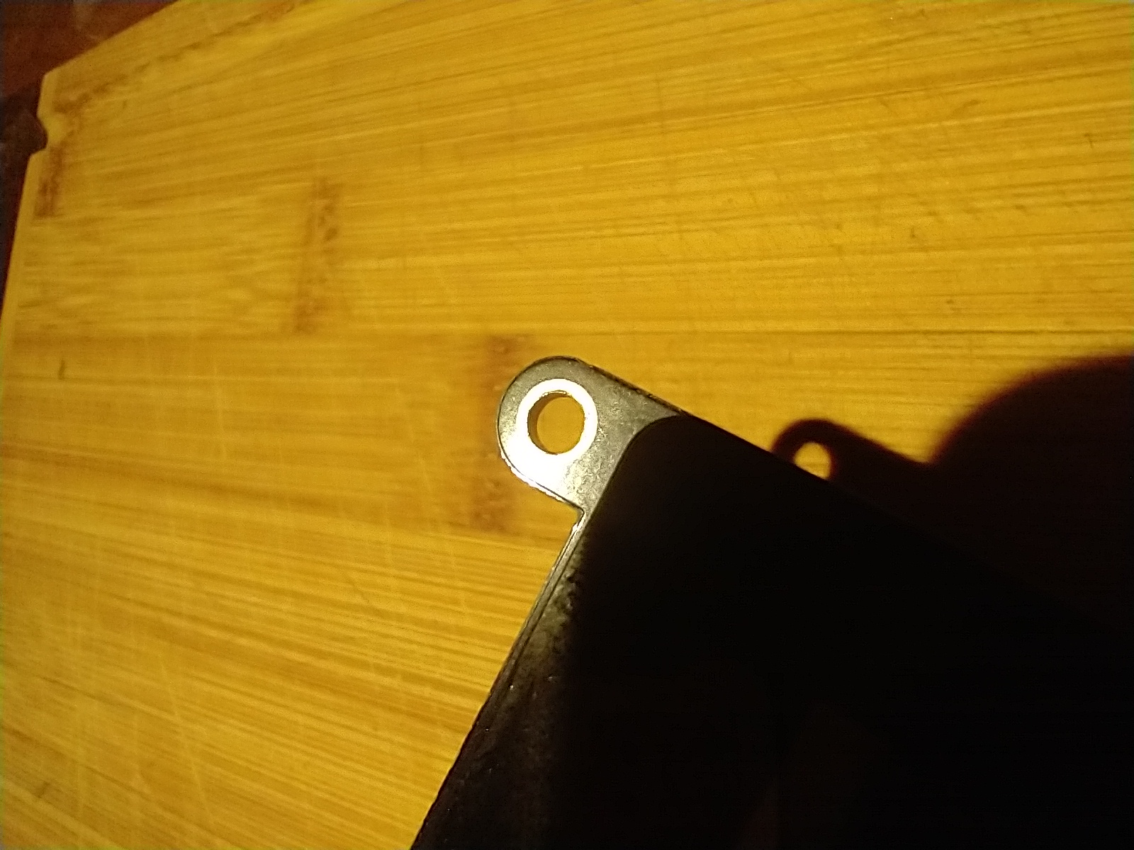 Screen mounting hole widened